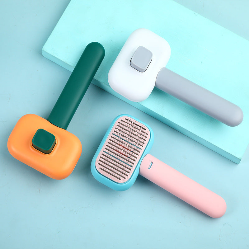 Self-cleaning slicker brushes in green, grey and pink