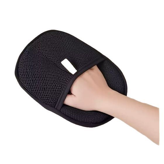 Hand wearing the black pet hair remover mitt